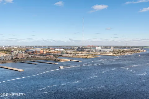 a dining room with furniture window and wooden floor