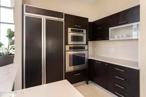 a view of a chairs and table in a balcony