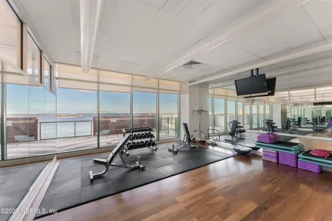 a bathroom with a glass shower door
