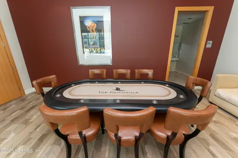 a living room with furniture a flat screen tv and a large window