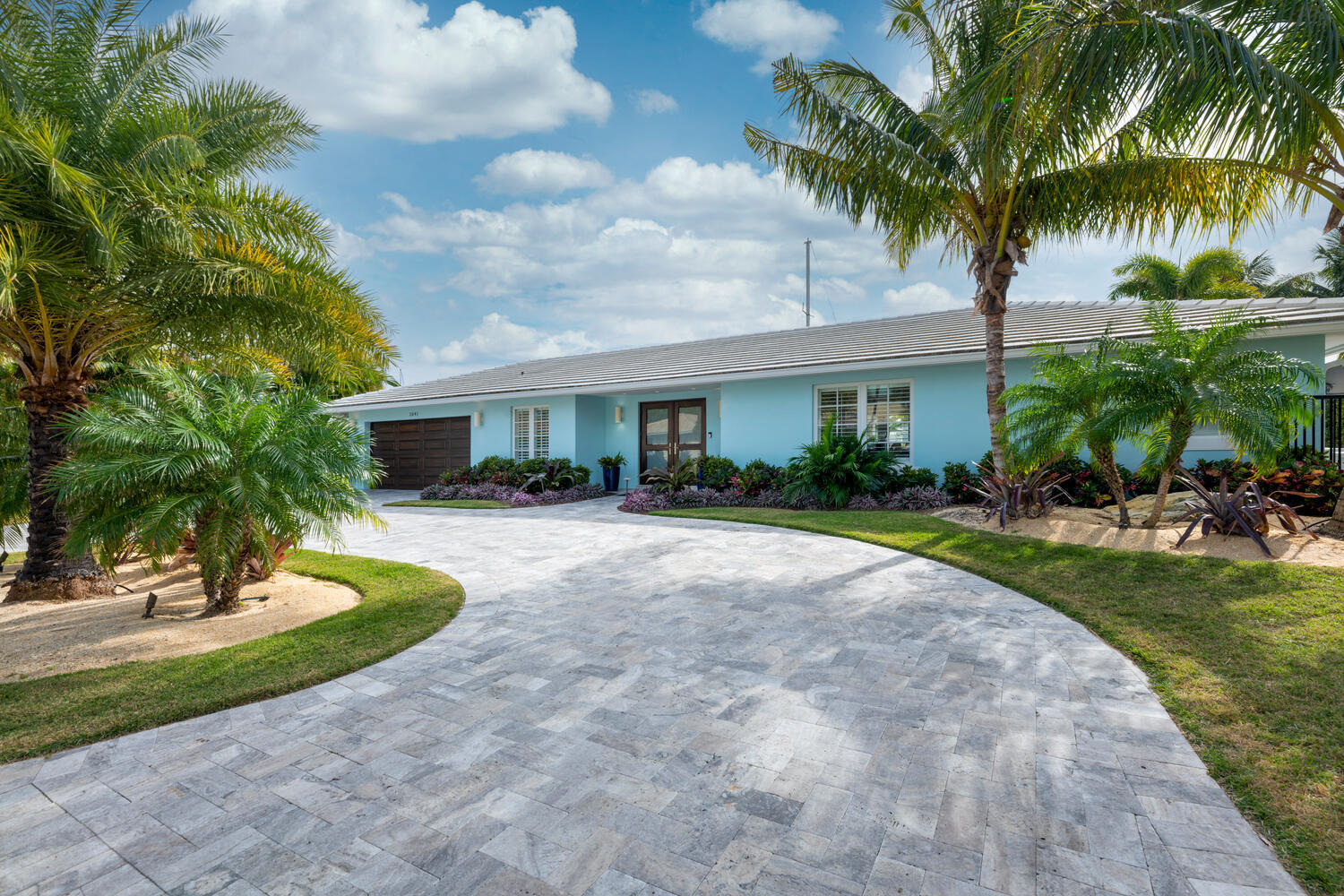 a view of a house with a swimming pool and a garden