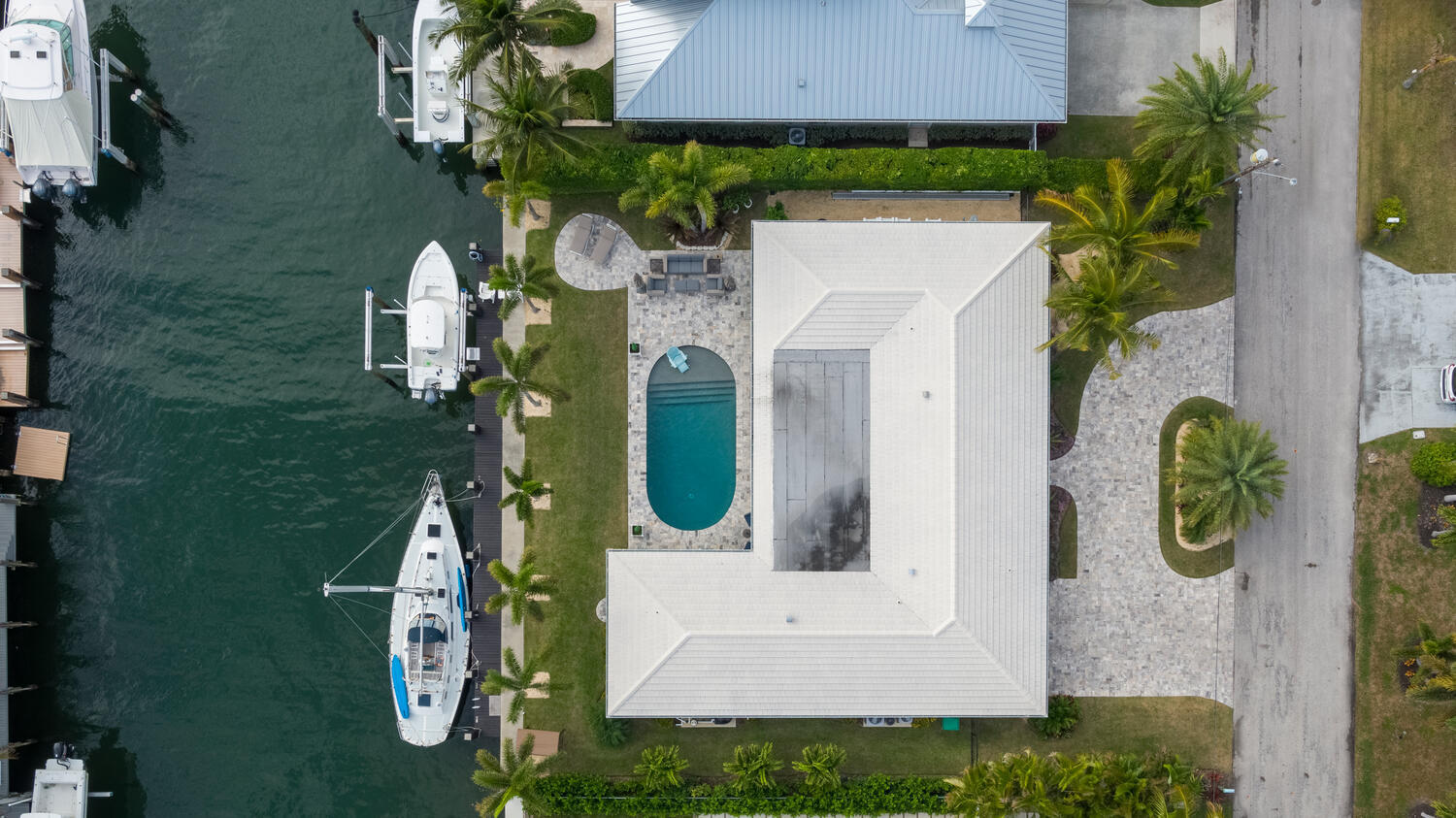 1041 Gulfstream Way Riviera Beach, FL 33404 - Photo 18 of 39 an aerial view of a house with a swimming pool
