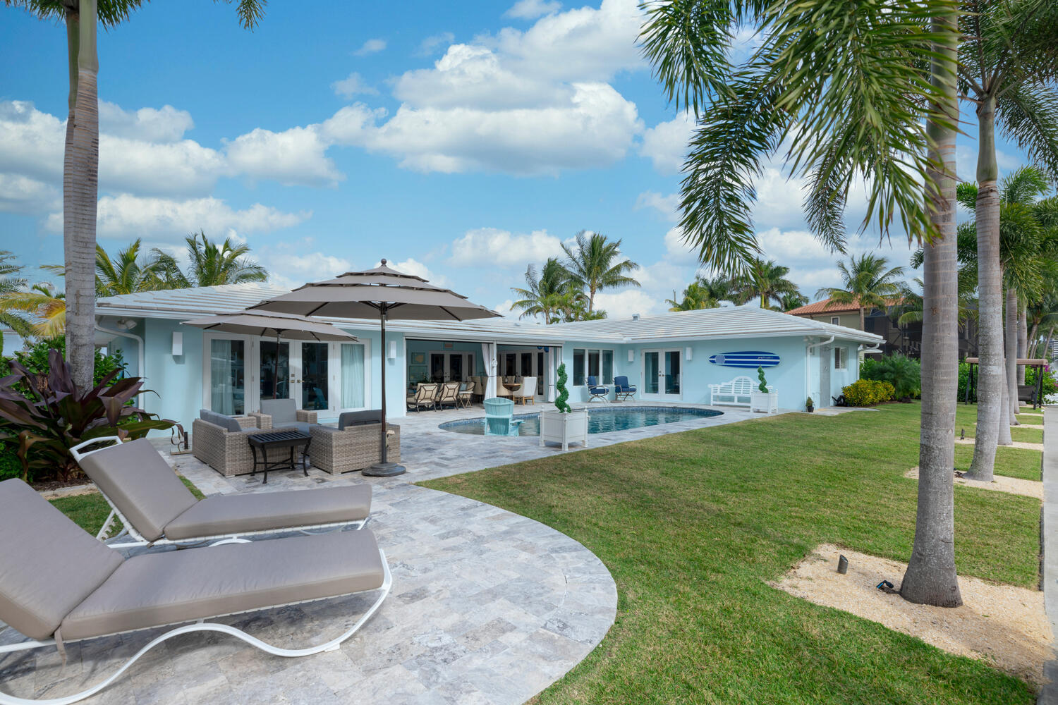 1041 Gulfstream Way Riviera Beach, FL 33404 - Photo 19 of 39 a front view of a house with garden