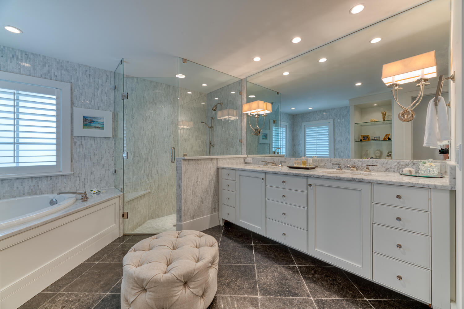 1041 Gulfstream Way Riviera Beach, FL 33404 - Photo 31 of 39 a spacious bathroom with a double vanity sink a mirror and a bathtub