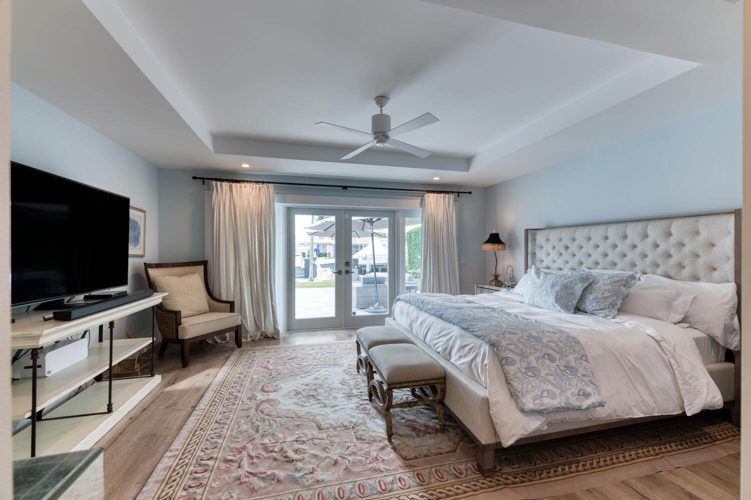 1041 Gulfstream Way Riviera Beach, FL 33404 - Photo 34 of 39 a bedroom with a bed and a flat screen tv