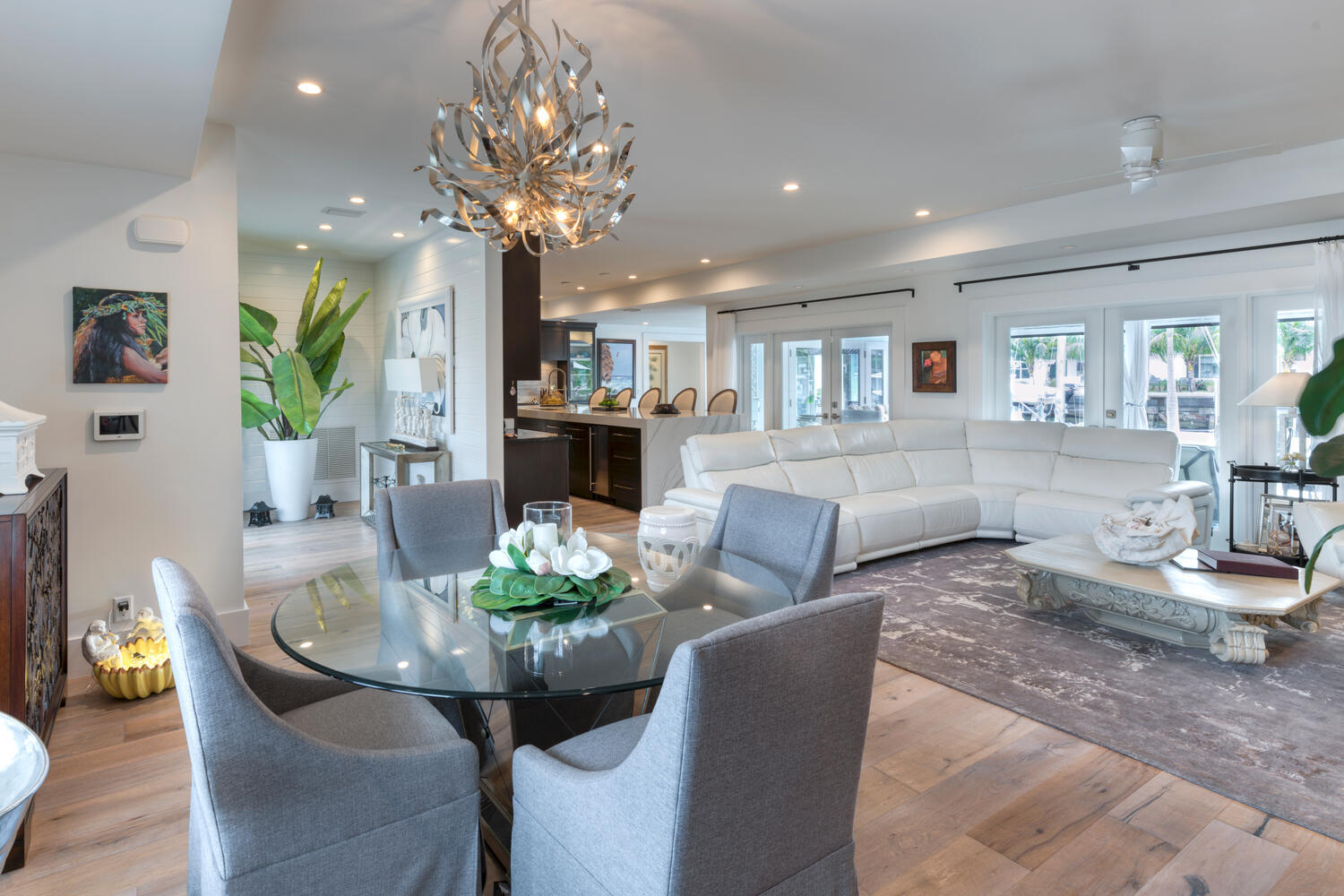1041 Gulfstream Way Riviera Beach, FL 33404 - Photo 4 of 39 a living room with furniture a chandelier and a dining table