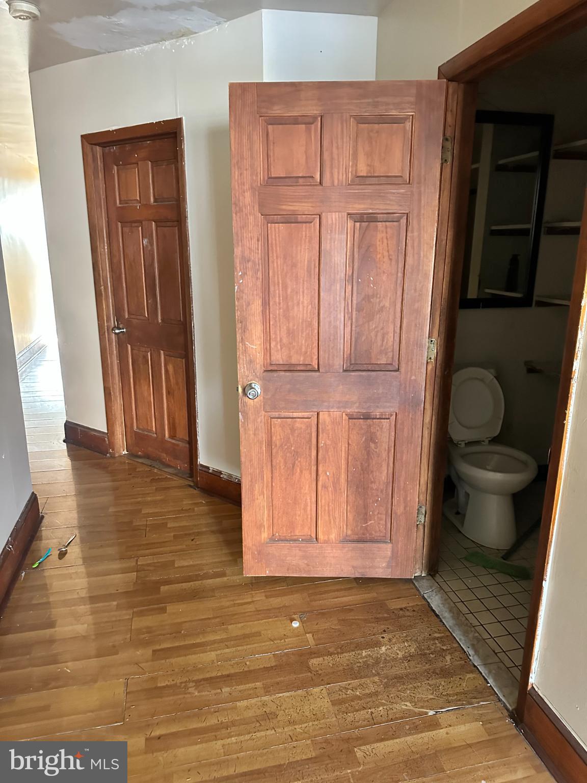 1508 West Nedro Avenue Philadelphia, PA 19141 - Photo 15 of 20 a view of empty room with wooden floor and fan