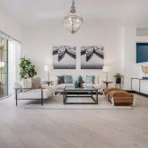 a bedroom with furniture and a chandelier