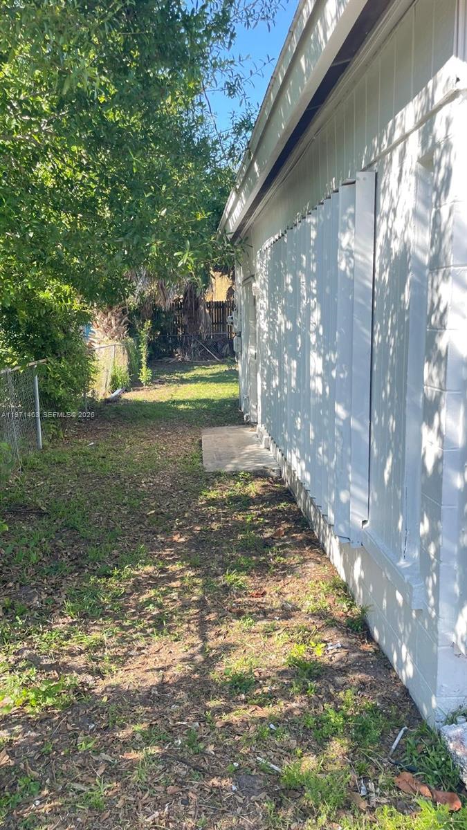 2908 Dunbar Street Fort Pierce, FL 34947 - Photo 5 of 10 a view of a yard with a tree