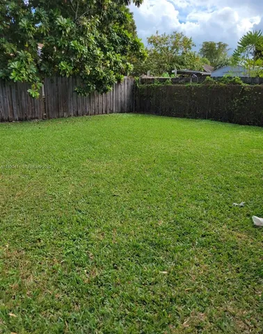 a view of a backyard with green space