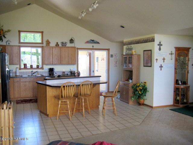 8810 Robillard Road Moxee, WA 98936 - Photo 7 of 29 a kitchen with granite countertop sink cabinets and stainless steel appliances