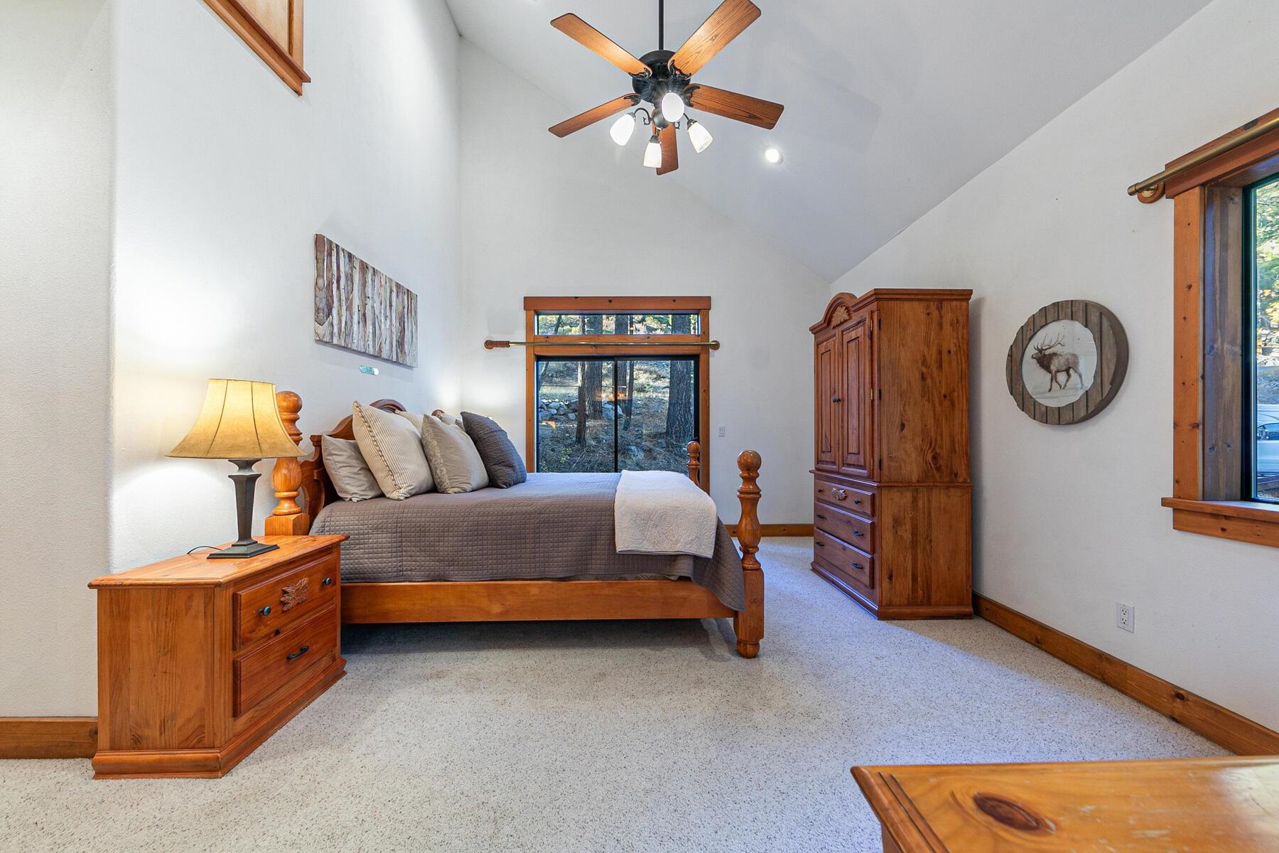 14580 Donner Pass Road Truckee, CA 96161 - Photo 18 of 27 Primary bedroom with vaulted ceilings and access to back patio