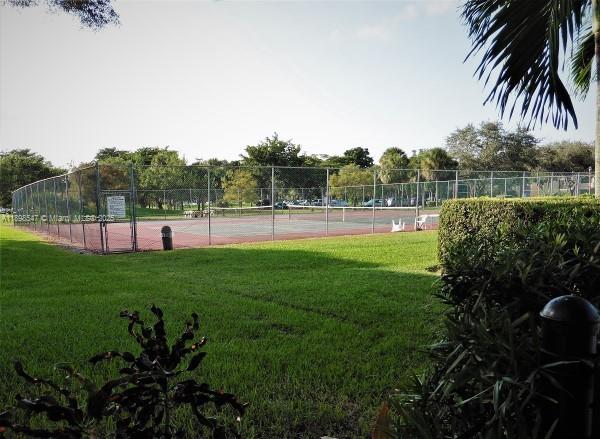 16200 Golf Club Road, Unit 312 Weston, FL 33326 - Photo 19 of 21 a view of outdoor space with garden and deck