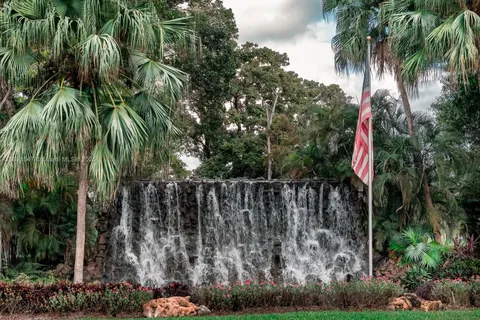 a view of street with tall trees