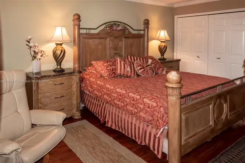 a bedroom with bed and window