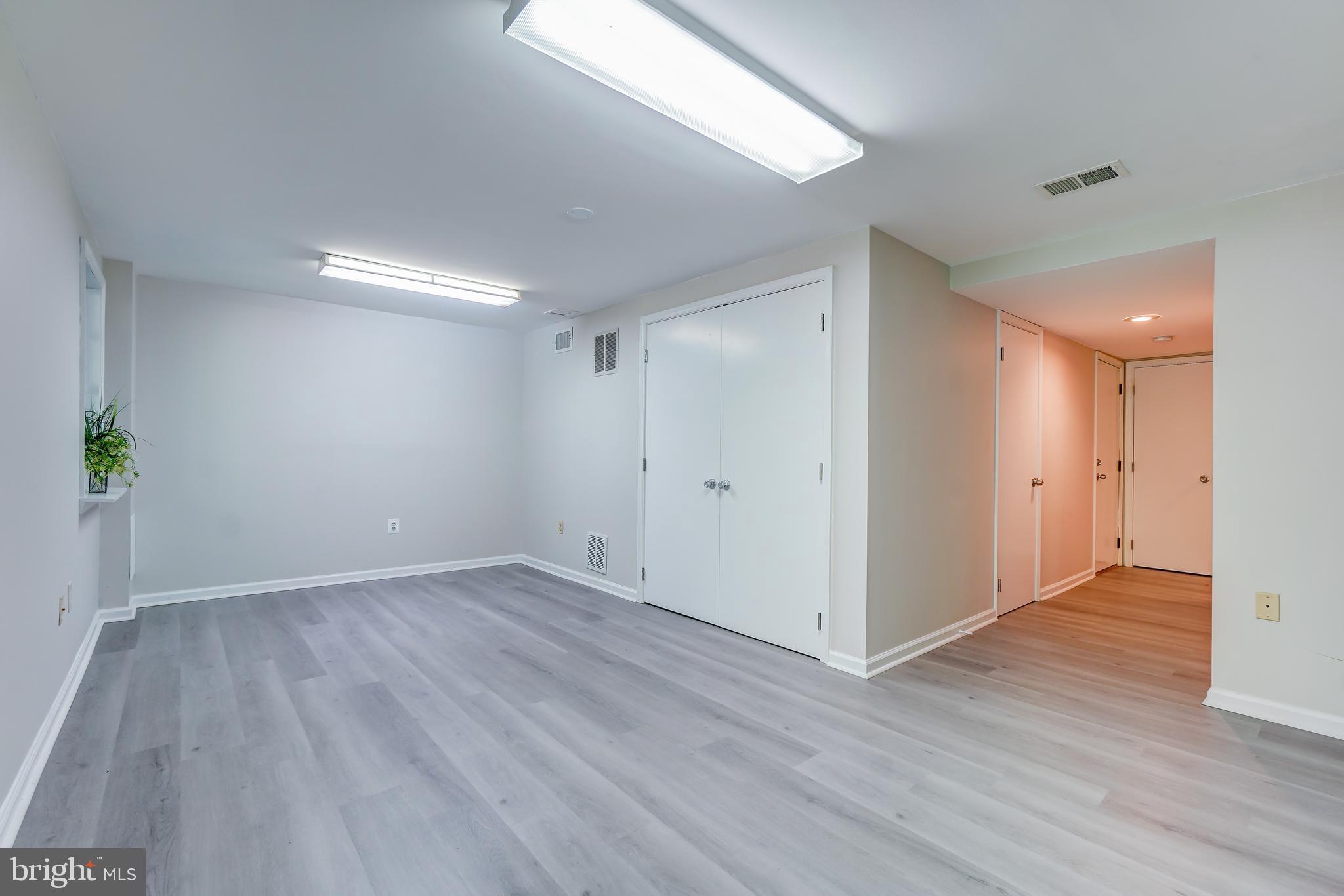 614 Suffield Drive Gaithersburg, MD 20878 - Photo 16 of 22 a view of an empty room with wooden floor