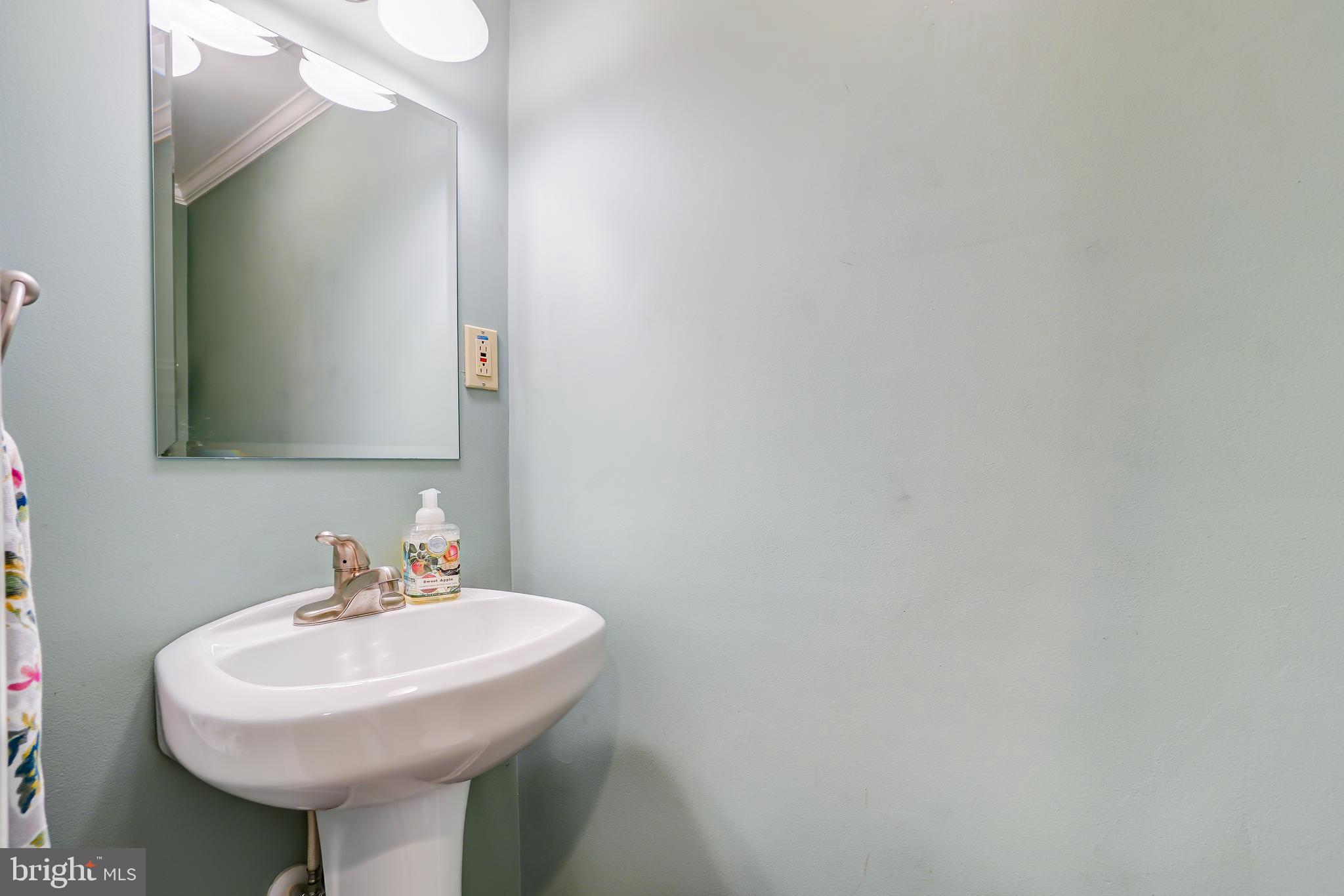 614 Suffield Drive Gaithersburg, MD 20878 - Photo 18 of 22 a bathroom with a sink and a mirror