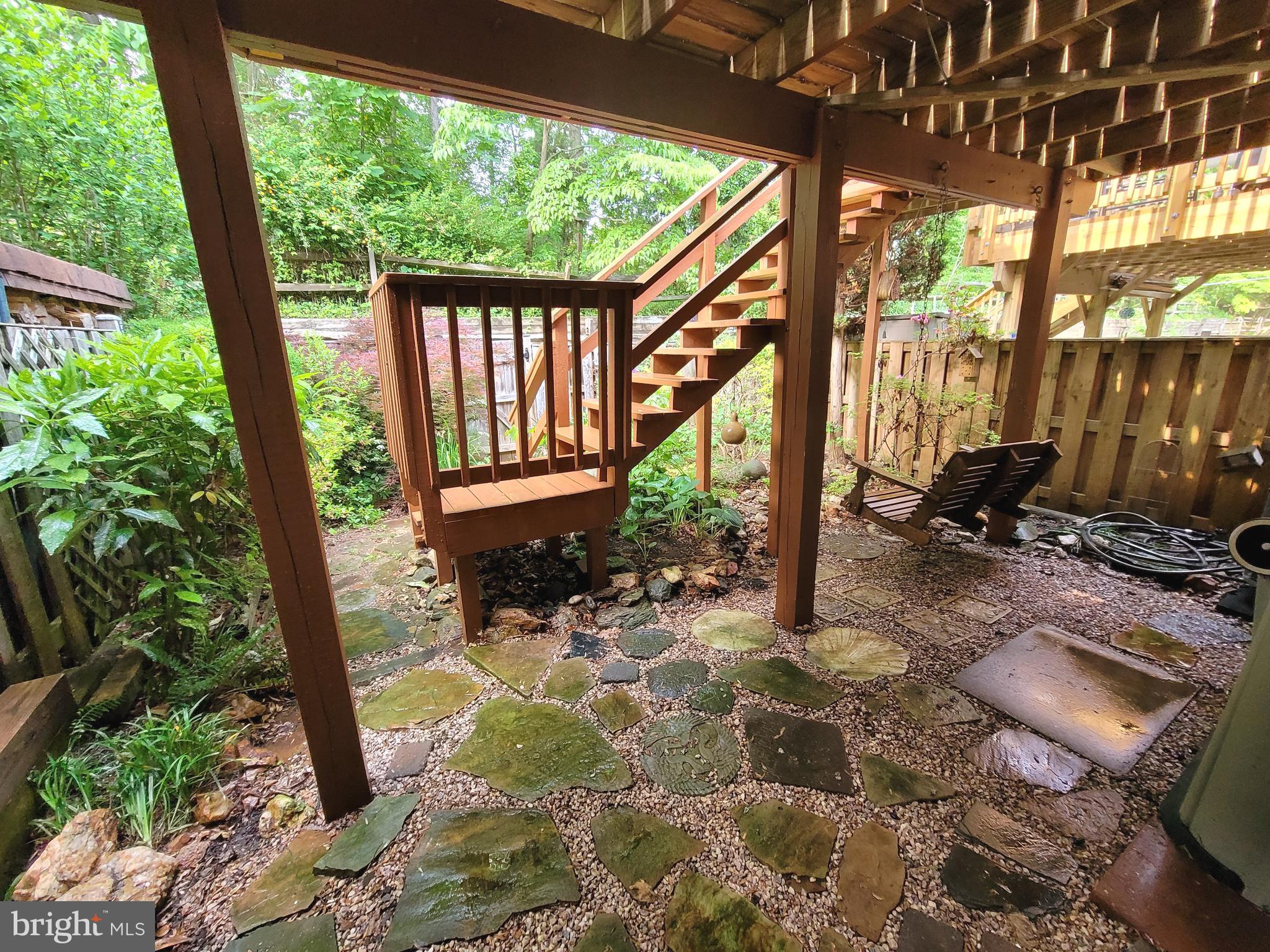 614 Suffield Drive Gaithersburg, MD 20878 - Photo 19 of 22 a view of a porch with chairs and backyard