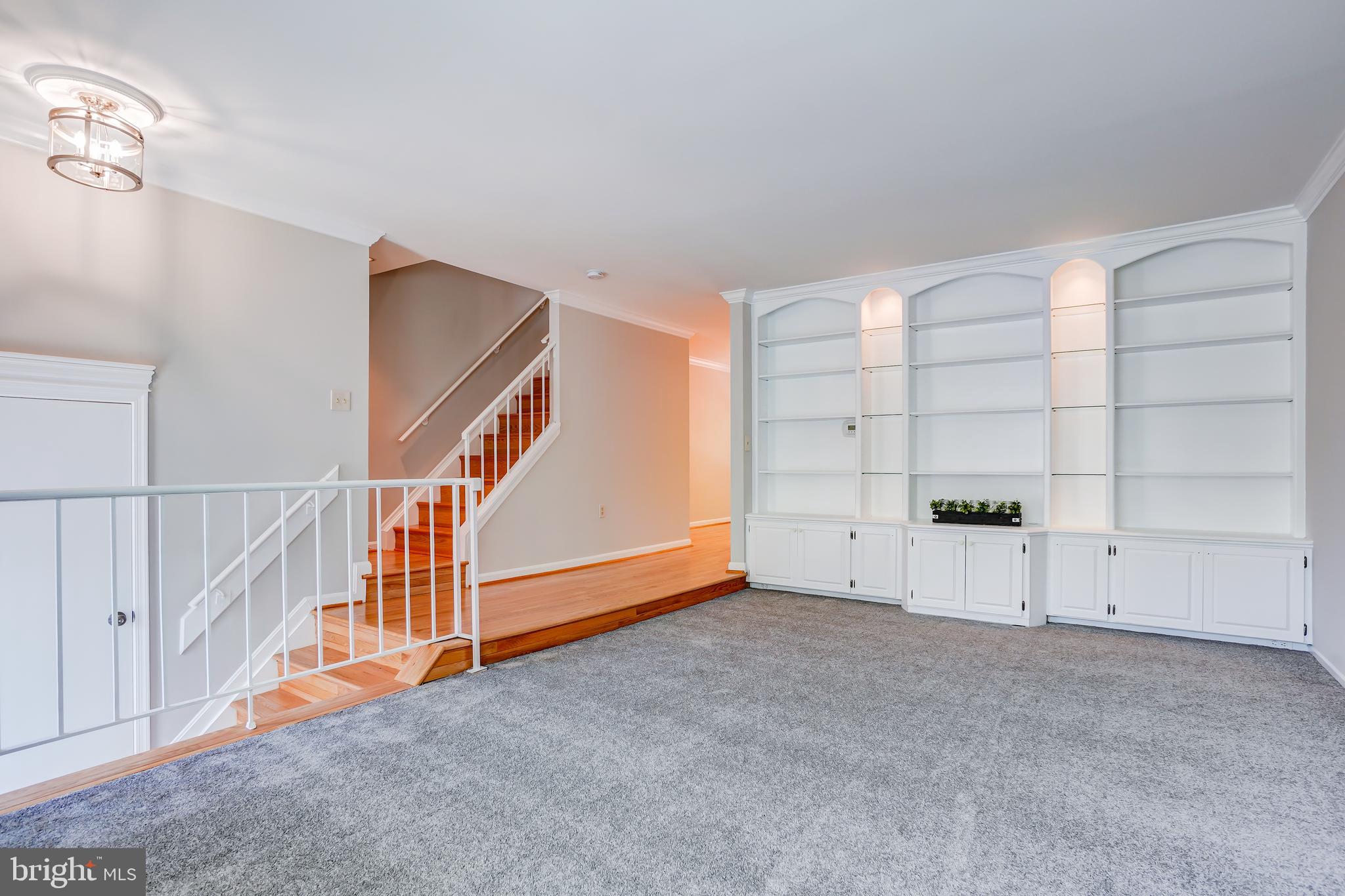 614 Suffield Drive Gaithersburg, MD 20878 - Photo 2 of 22 a view of an empty room with stairs and a window