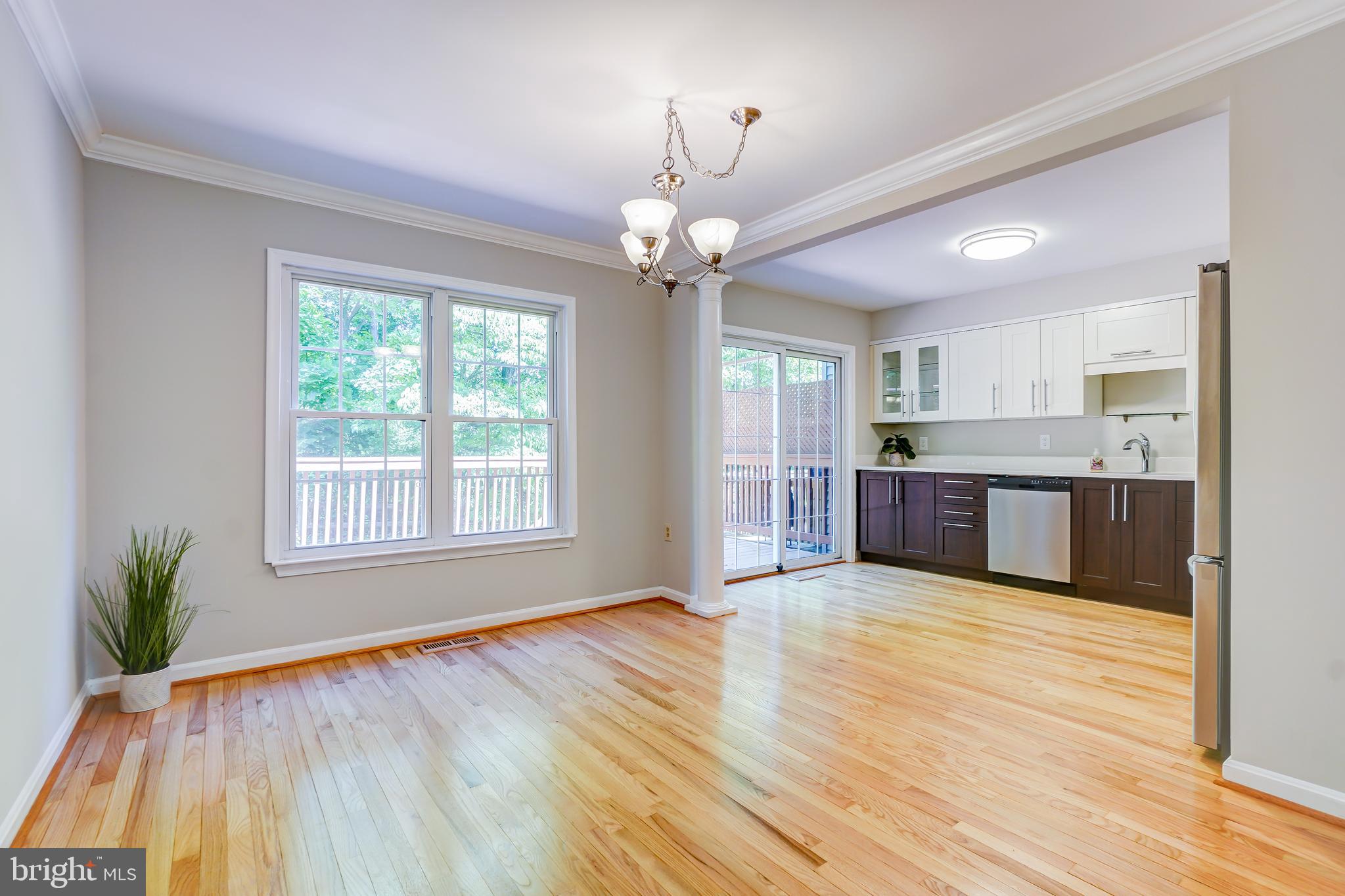614 Suffield Drive Gaithersburg, MD 20878 - Photo 4 of 22 a view of an empty room with window and wooden floor