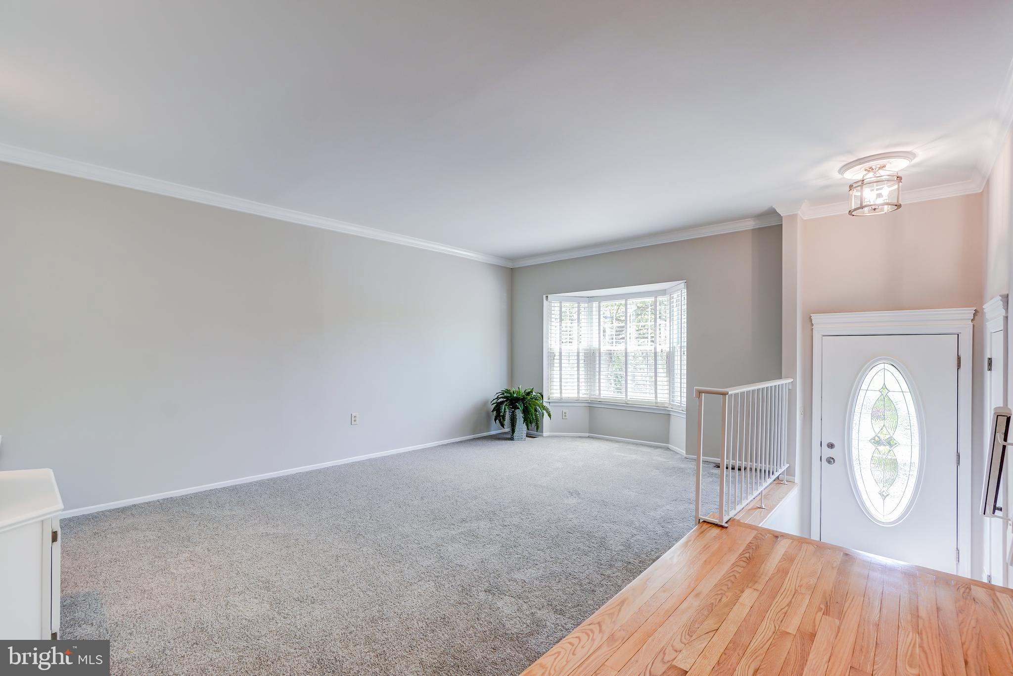 614 Suffield Drive Gaithersburg, MD 20878 - Photo 8 of 22 a view of a livingroom with furniture and a window