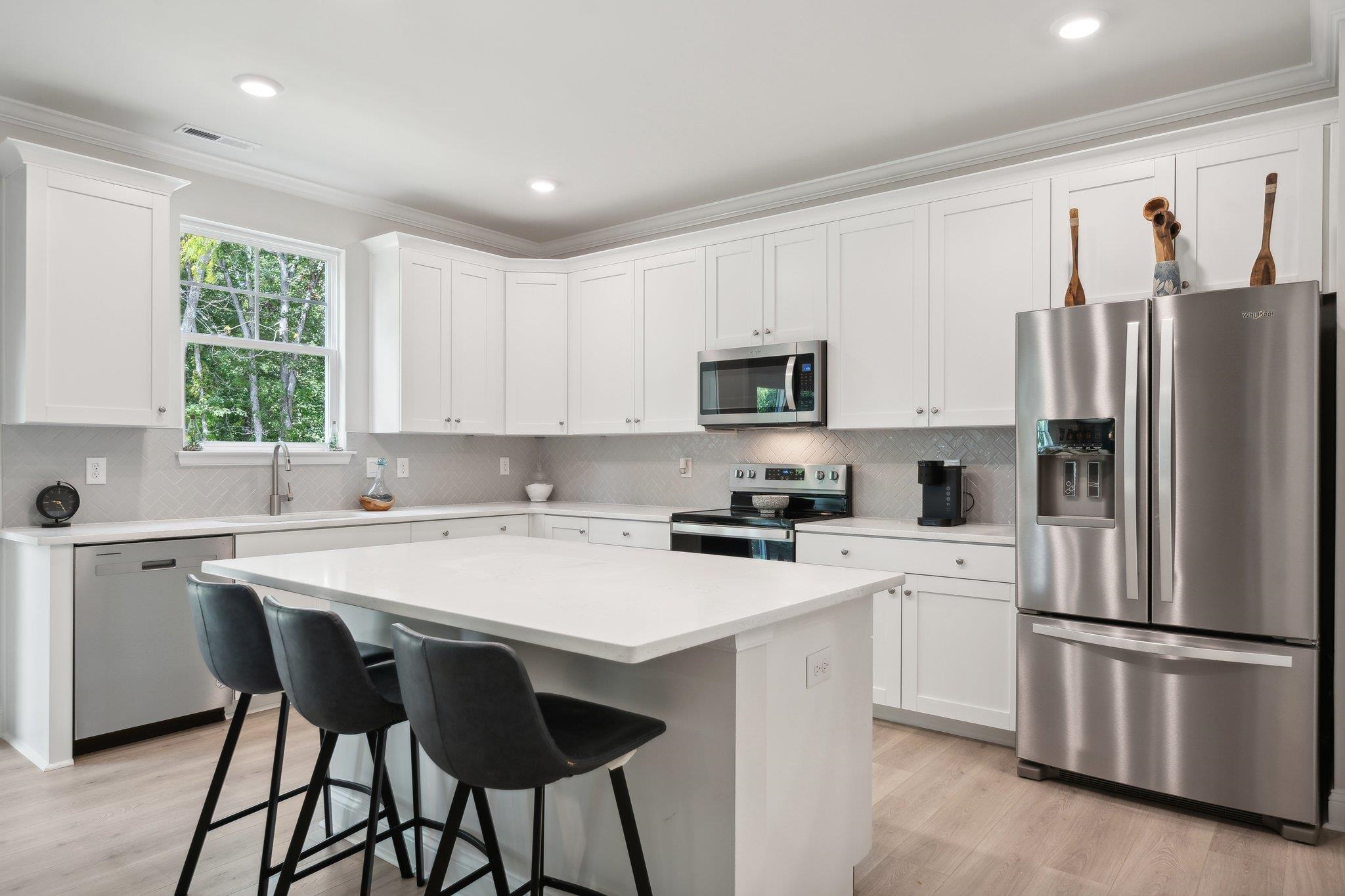 60 Jaspers Lane Stuarts Draft, VA 24477 - Photo 12 of 31 a kitchen with white cabinets and white stainless steel appliances