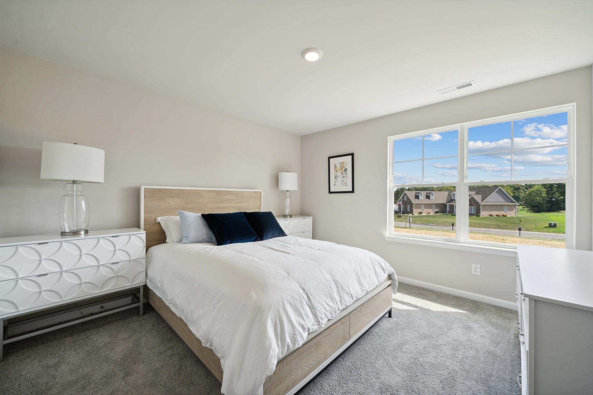 60 Jaspers Lane Stuarts Draft, VA 24477 - Photo 10 of 31 a bedroom with a large bed and a window