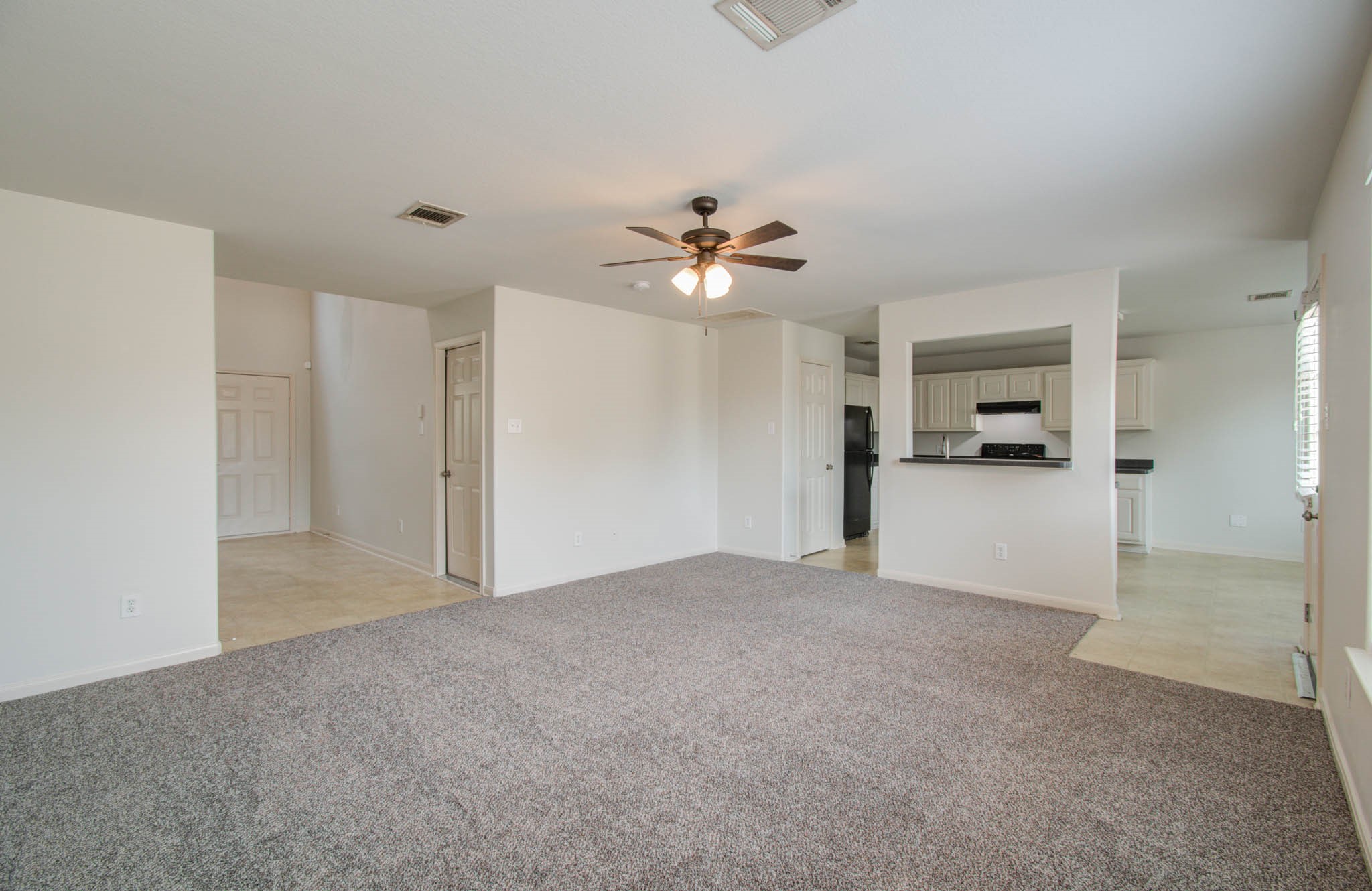 4239 Nueces River Loop Spring, TX 77386 - Photo 13 of 50 a view of a big room with closet and a ceiling fan