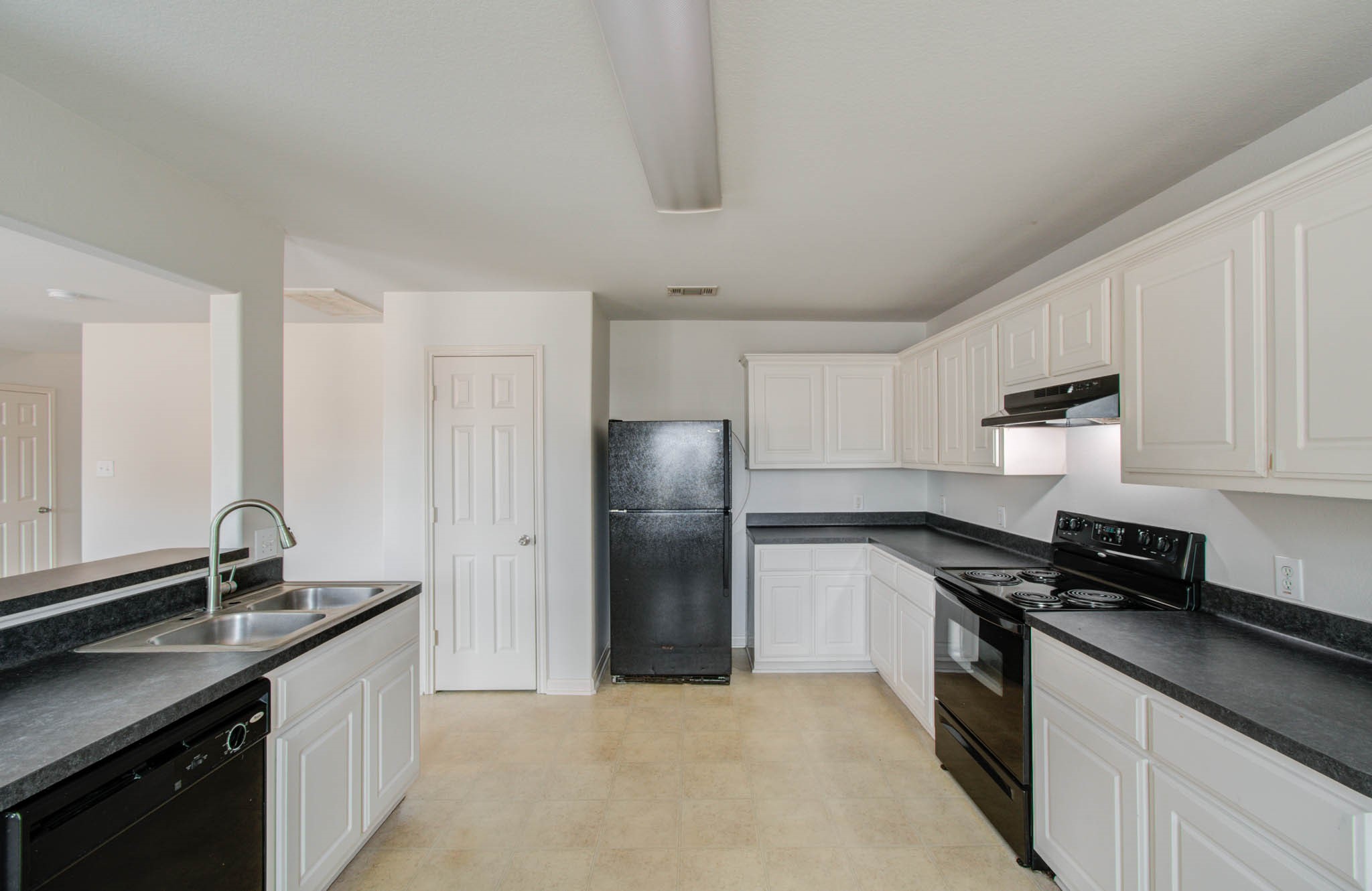 4239 Nueces River Loop Spring, TX 77386 - Photo 19 of 50 a kitchen with stainless steel appliances granite countertop a sink stove and refrigerator