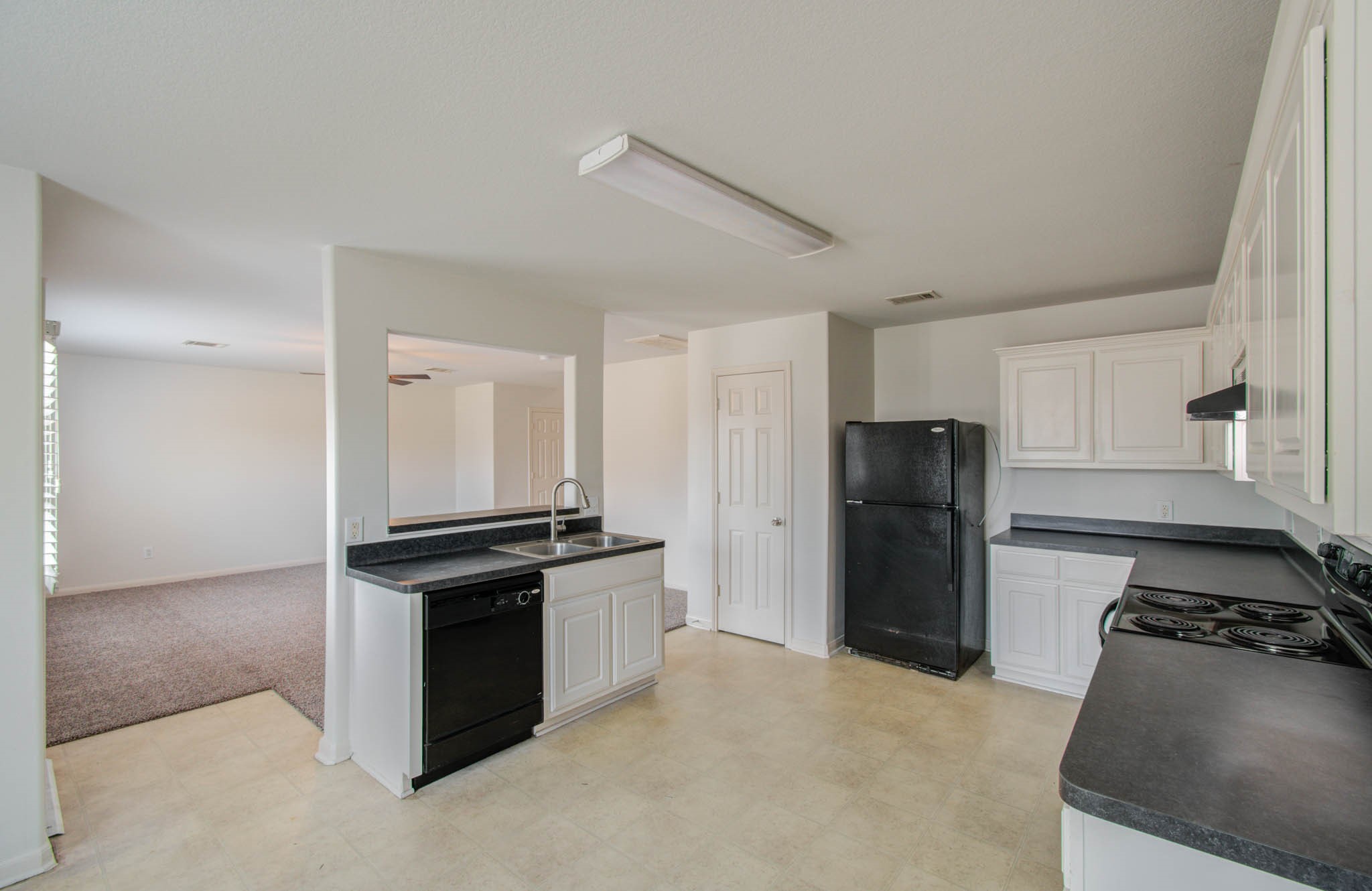 4239 Nueces River Loop Spring, TX 77386 - Photo 20 of 50 a kitchen with stainless steel appliances granite countertop a refrigerator and a stove