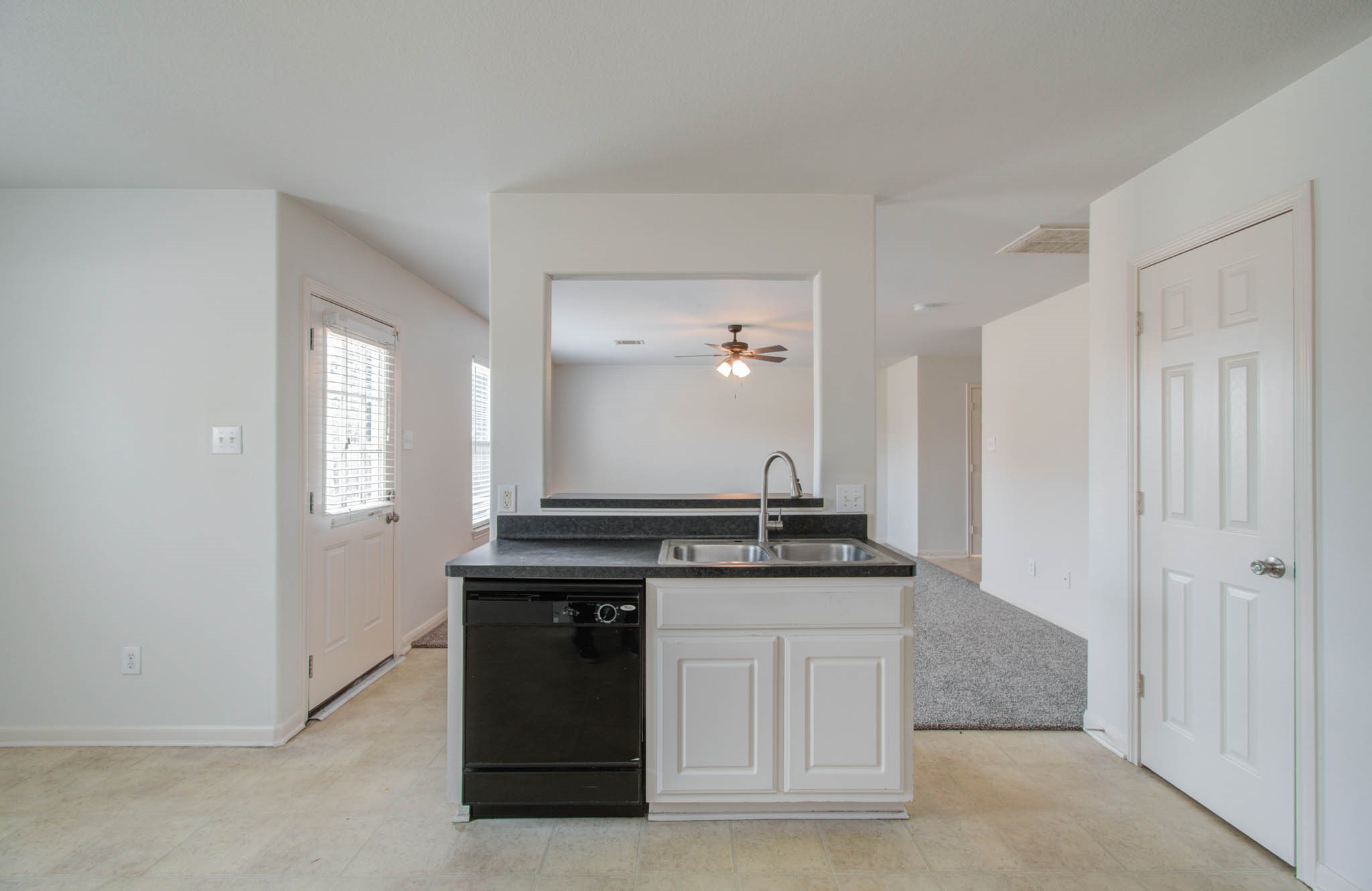 4239 Nueces River Loop Spring, TX 77386 - Photo 23 of 50 a kitchen with a sink and a refrigerator