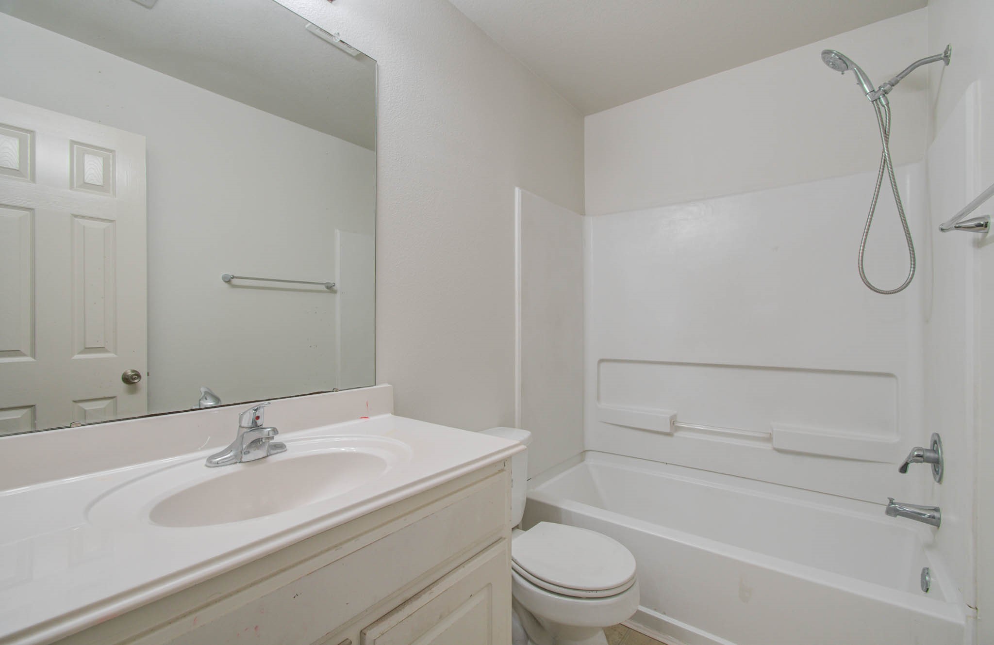 4239 Nueces River Loop Spring, TX 77386 - Photo 39 of 50 a bathroom with a granite countertop sink toilet and shower