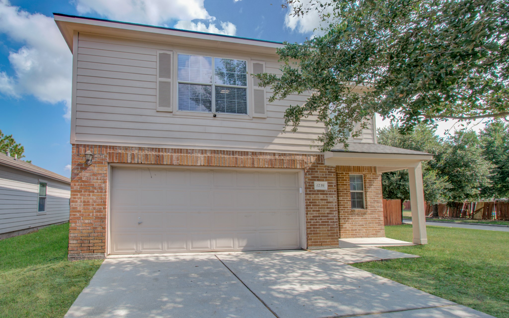 4239 Nueces River Loop Spring, TX 77386 - Photo 4 of 50 a front view of a house with a garden