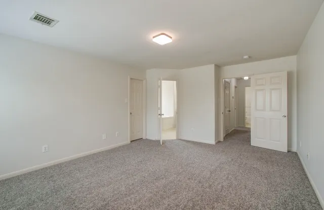 a bathroom with a bathtub and a toilet