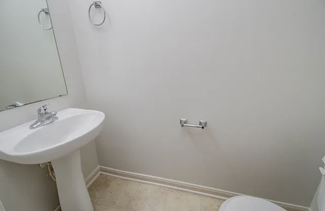 a bathroom with a sink and mirror