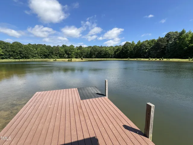 a view of a balcony with lake view and a floor to ceiling window