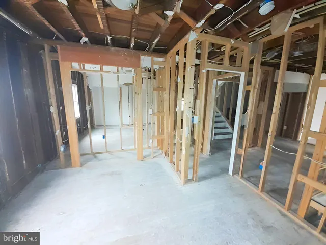 a white toilet sitting next to a sink