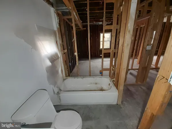 a view of entryway with a door and stairs