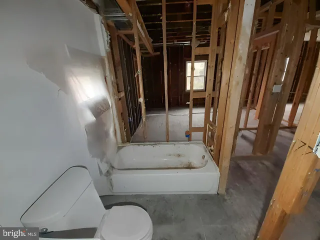 a view of entryway with a door and stairs