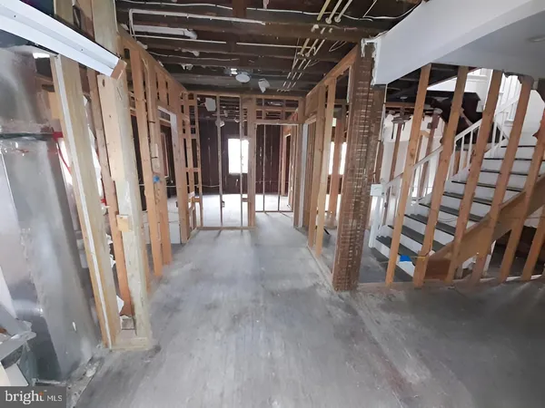 a kitchen with a sink stove and mirror