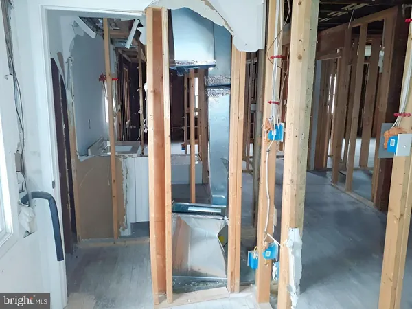 a kitchen with granite countertop a sink and a stove