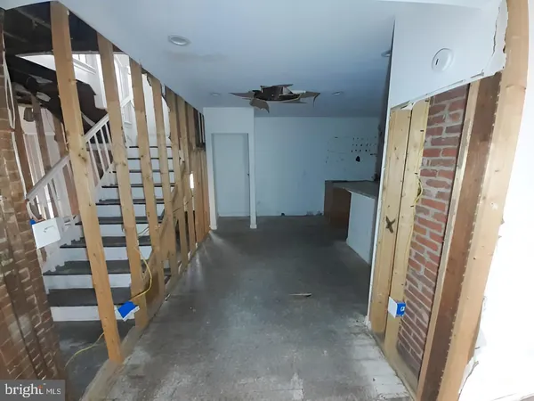 a bathroom with a granite countertop bathtub toilet and window