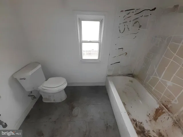 a view of a hallway with stairs