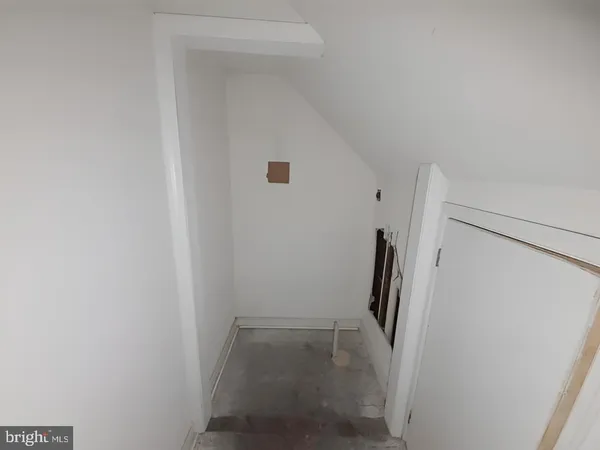 a view of an empty room with stairs