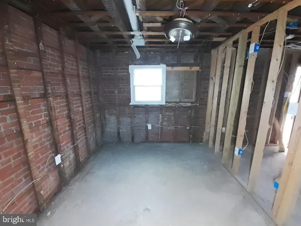 a view of a hallway with wooden walls
