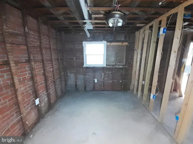 a view of a hallway with wooden walls