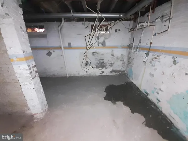 a white toilet sitting next to a bath tub