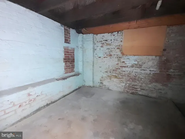 a view of a hallway with wooden floor and entryway