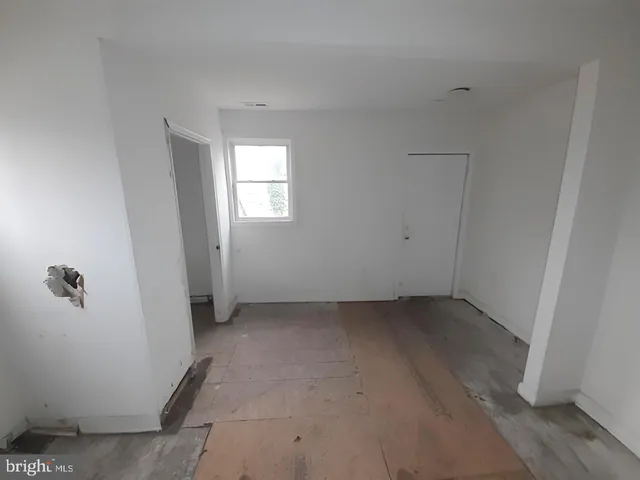 a view of an empty room with stairs