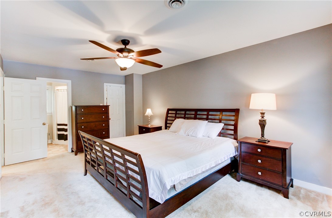 703 Fennimore Road Midlothian, VA 23114 - Photo 12 of 22 a bedroom with a bed and dresser